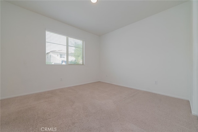 empty room featuring light carpet