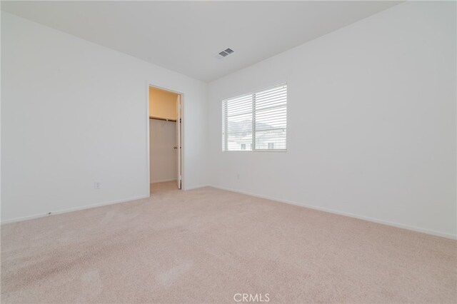 empty room featuring light carpet