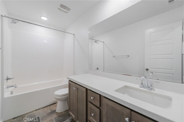 full bathroom with toilet, vanity, and  shower combination