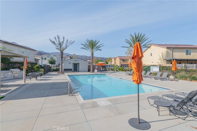 view of swimming pool with a patio