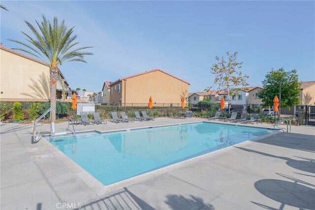 view of swimming pool with a patio area