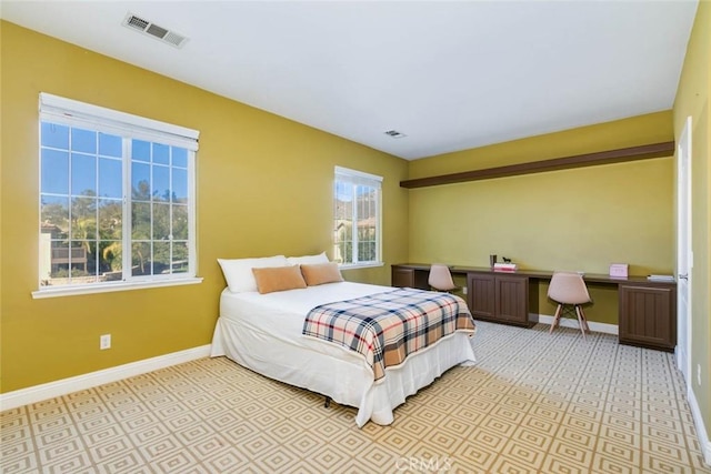 bedroom featuring multiple windows