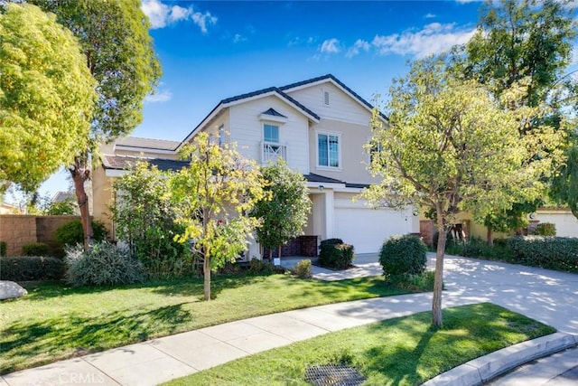 view of front of home with a front lawn and a garage