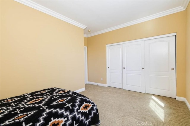 carpeted bedroom with a closet and ornamental molding