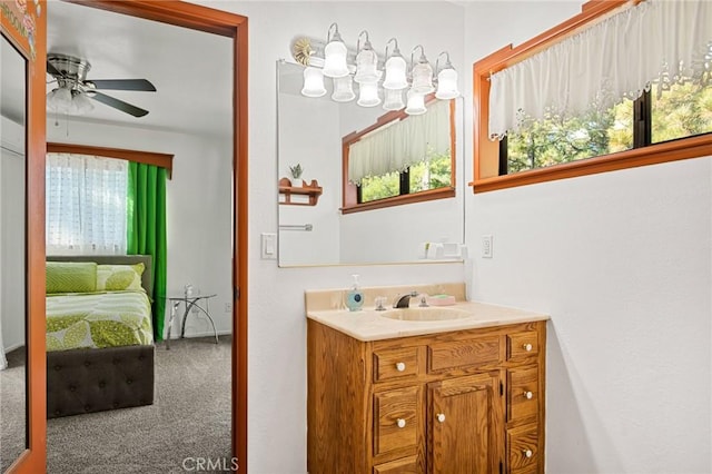 bathroom featuring ceiling fan, plenty of natural light, and vanity