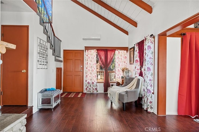 foyer entrance with a wall mounted AC, beamed ceiling, dark wood-type flooring, wood ceiling, and high vaulted ceiling