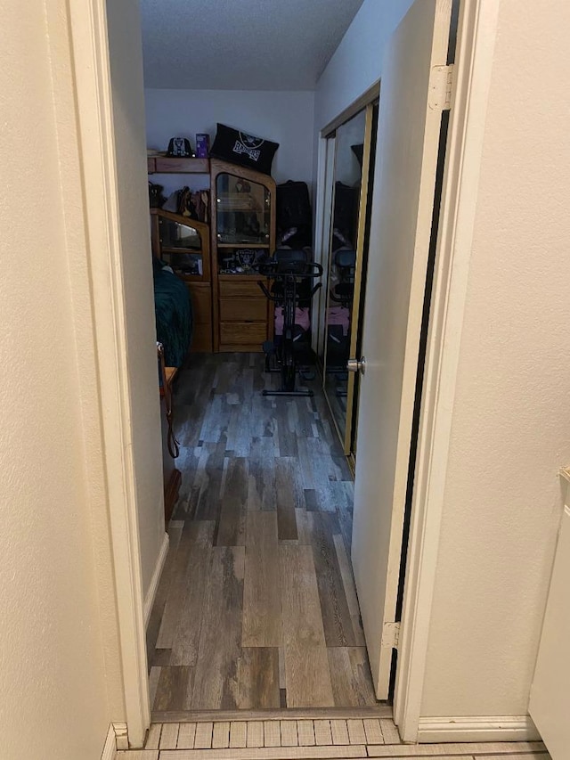 hallway featuring hardwood / wood-style flooring