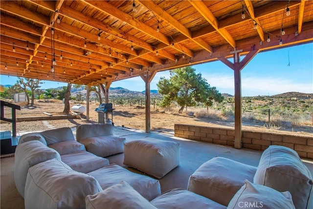 view of patio / terrace with a mountain view