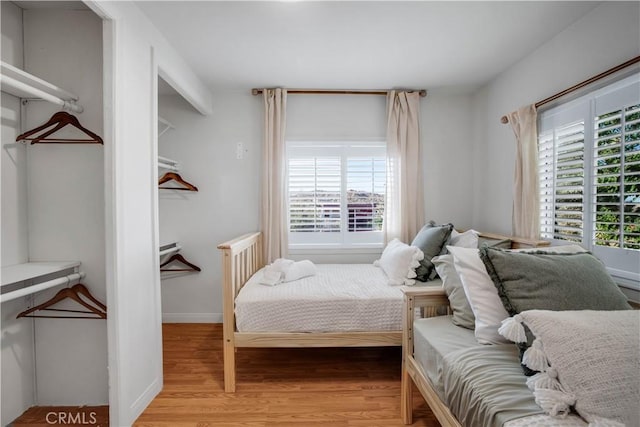 bedroom with light hardwood / wood-style floors