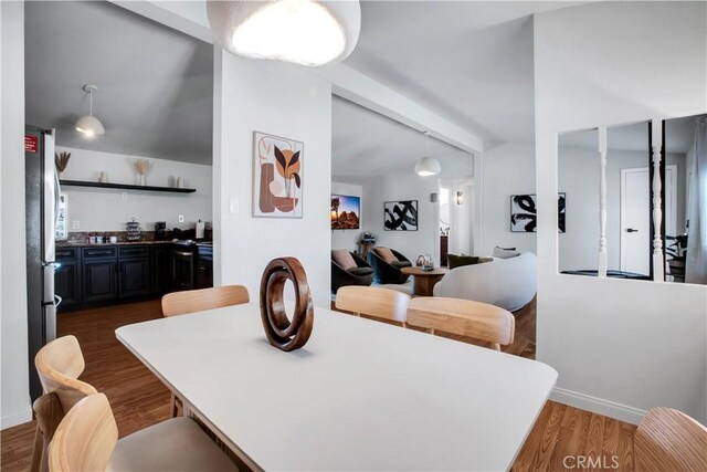 dining room with dark hardwood / wood-style flooring