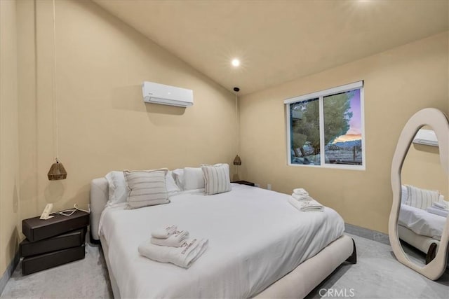 bedroom with vaulted ceiling and a wall mounted air conditioner