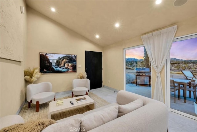 living room featuring vaulted ceiling