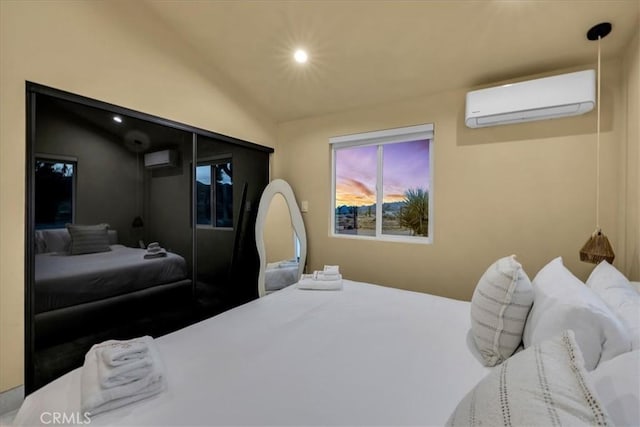 bedroom featuring a wall mounted AC and vaulted ceiling