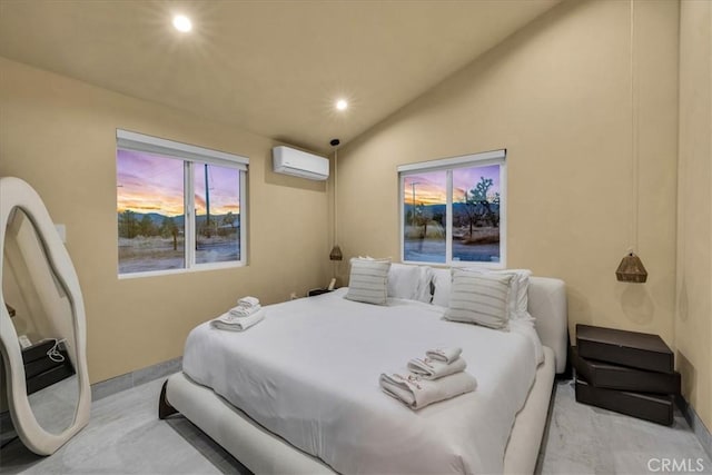 bedroom featuring vaulted ceiling and a wall unit AC