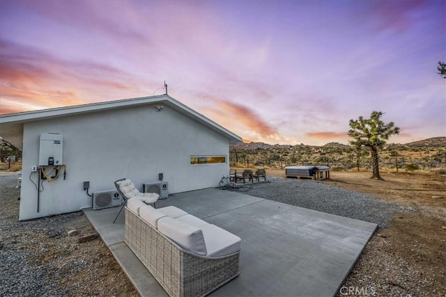 exterior space with a mountain view and ac unit