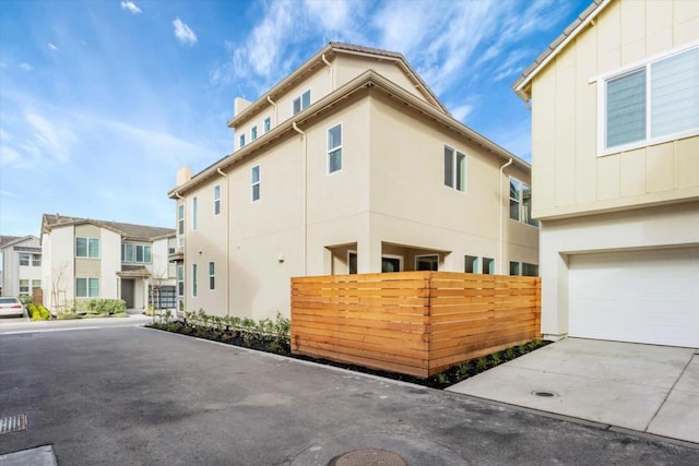 view of side of property featuring a garage