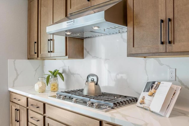 kitchen featuring stainless steel gas cooktop and backsplash