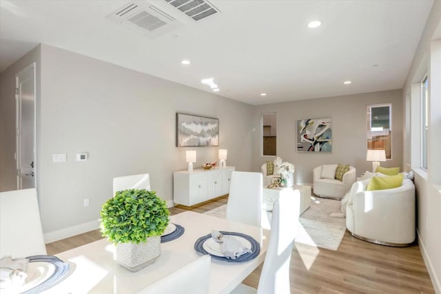 dining space featuring light wood-type flooring