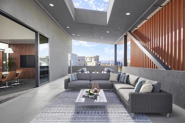 living room featuring concrete floors