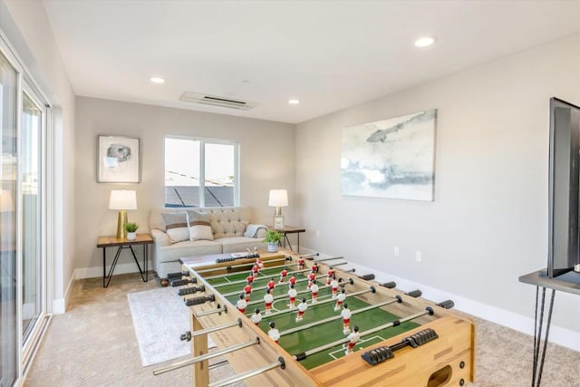 recreation room featuring carpet flooring and a wealth of natural light