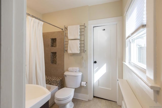 bathroom featuring hardwood / wood-style flooring, toilet, and sink