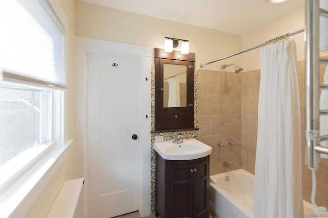 bathroom with shower / tub combo with curtain and vanity