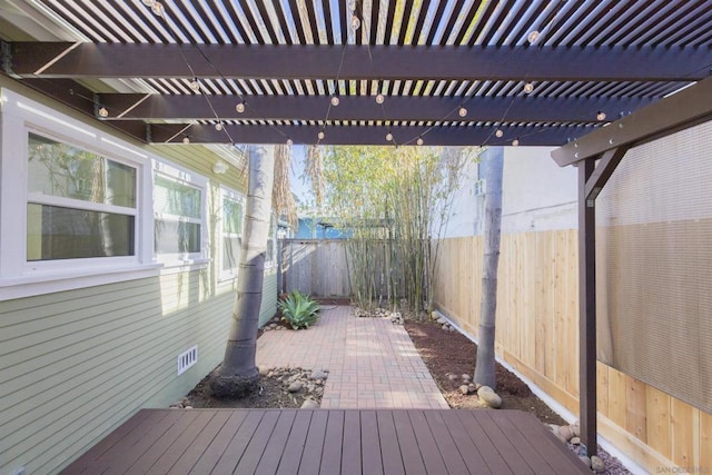 wooden deck with a patio area