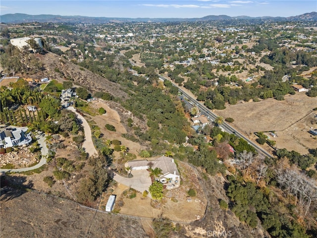 drone / aerial view featuring a mountain view