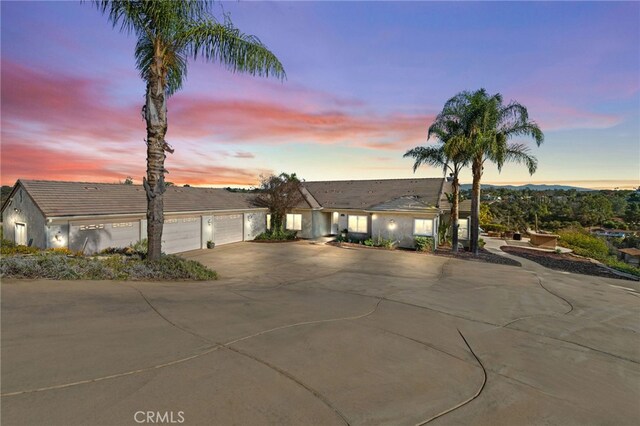 ranch-style house featuring a garage