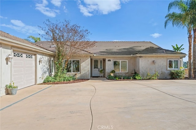 2240 Aqua Hill Rd, Fallbrook, CA 92028 - ranch-style house featuring driveway, stucco siding, a tiled roof, and a garage
