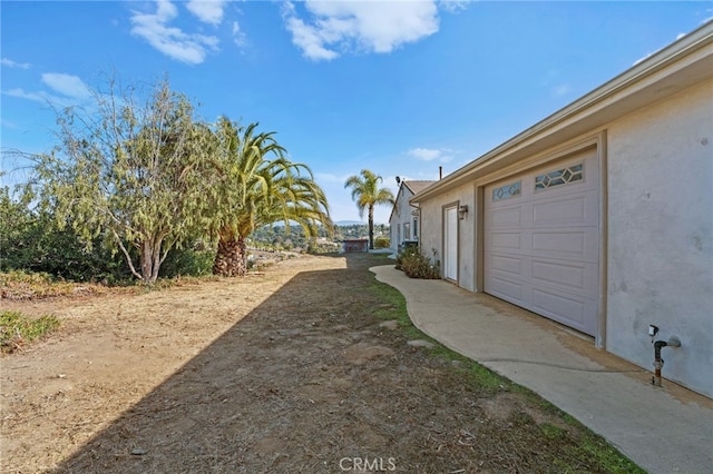 view of yard with a garage