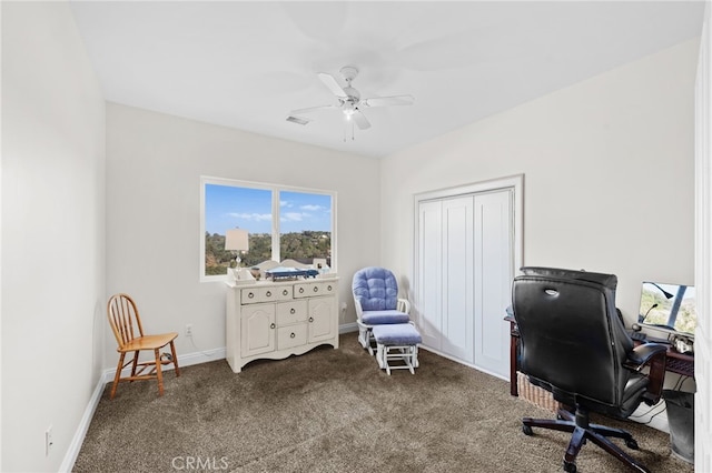 carpeted office space with ceiling fan