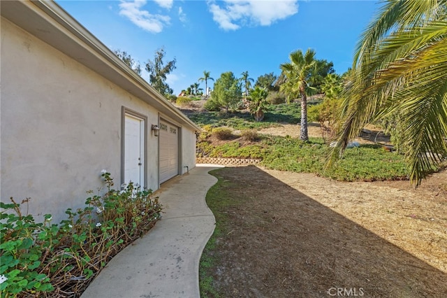 view of yard featuring a garage