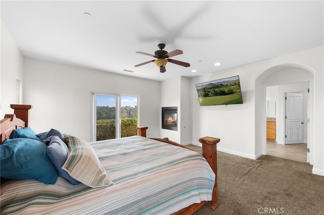 bedroom with ceiling fan and carpet flooring