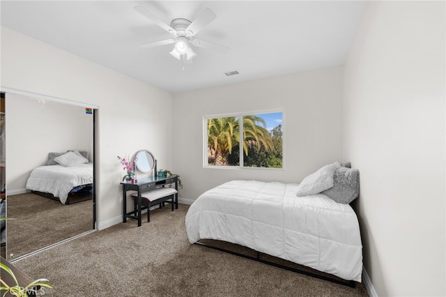 carpeted bedroom featuring a closet and ceiling fan