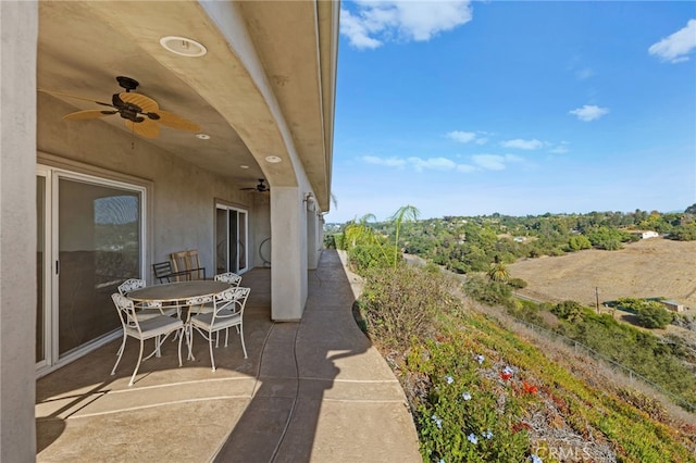 view of patio featuring ceiling fan