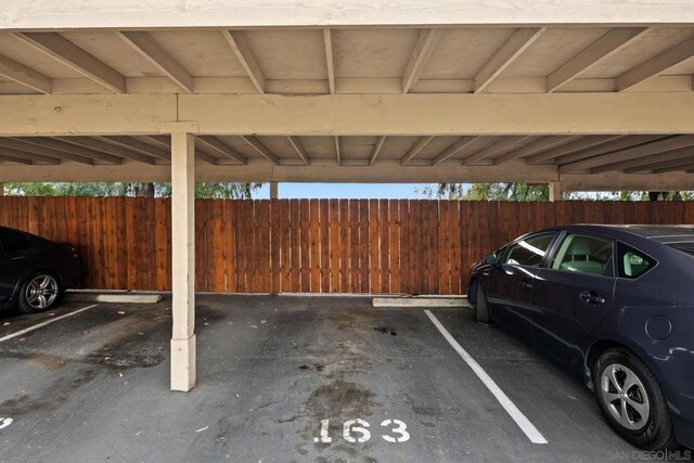 view of vehicle parking with a carport