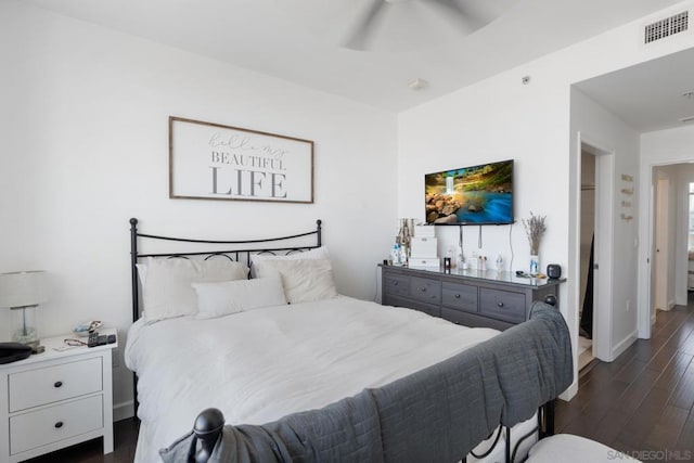 bedroom featuring ceiling fan and dark hardwood / wood-style flooring