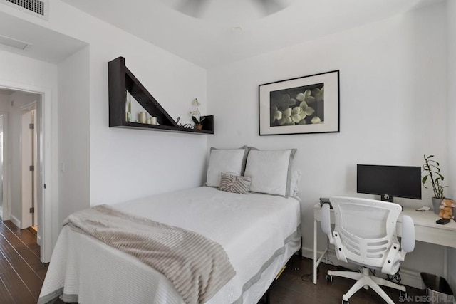 bedroom with dark wood-type flooring and ceiling fan