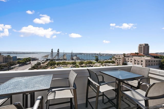 balcony featuring a water view