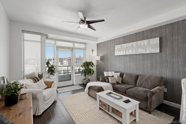 living room with light wood-type flooring and ceiling fan