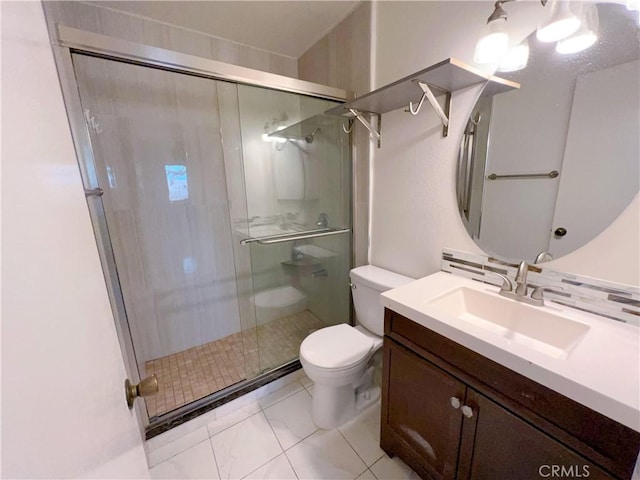 bathroom with toilet, vanity, tile patterned floors, and a shower with door