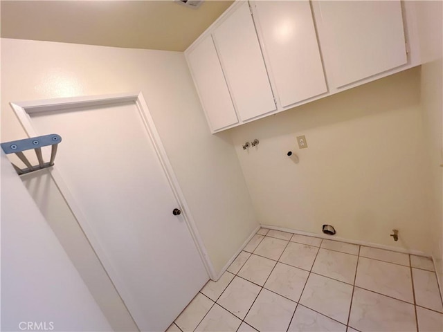 laundry area featuring cabinets, light tile patterned floors, hookup for a washing machine, and hookup for an electric dryer