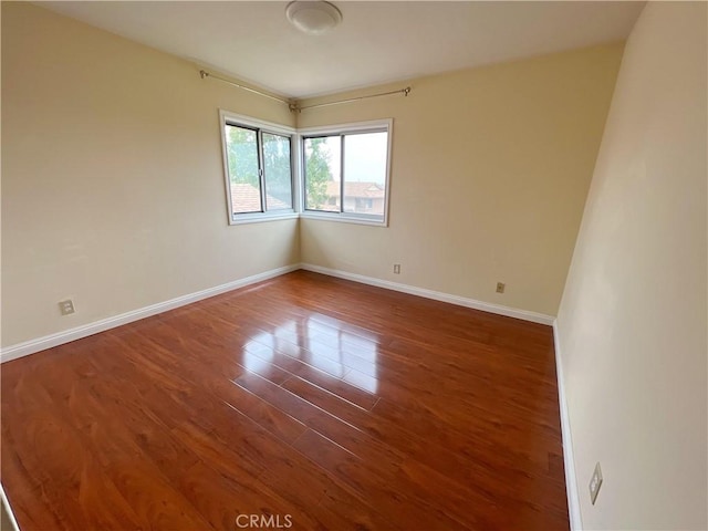 empty room featuring dark hardwood / wood-style floors