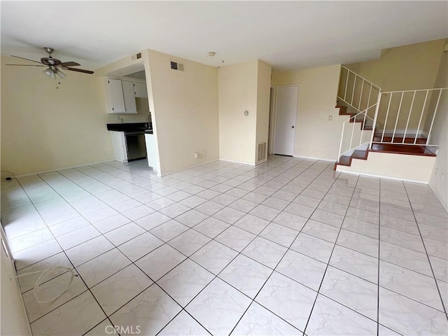 unfurnished living room with ceiling fan