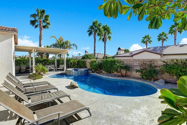 view of swimming pool with an in ground hot tub and a patio area