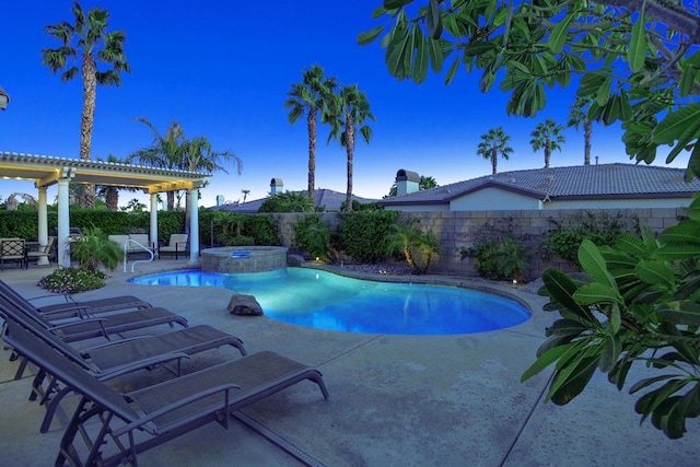 view of swimming pool with an in ground hot tub and a patio