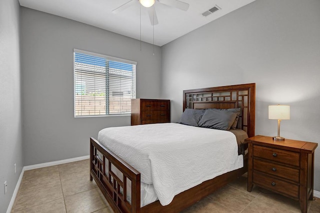 tiled bedroom featuring ceiling fan