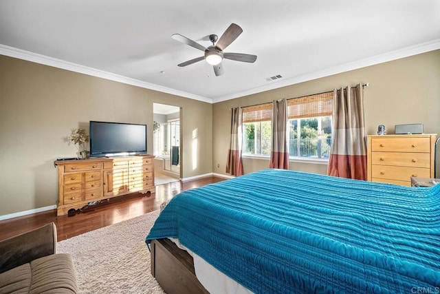 bedroom featuring ceiling fan, ornamental molding, and wood-type flooring