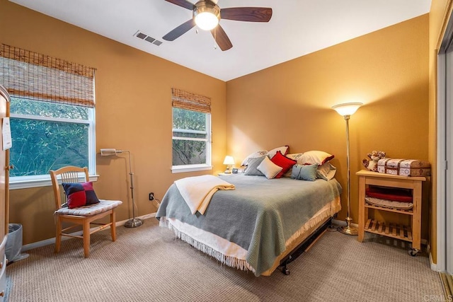 carpeted bedroom with ceiling fan